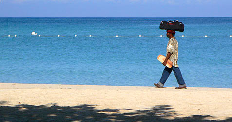 Man walking on Negril beach